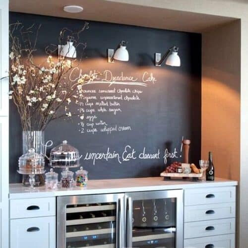 This chalkboard wall serves as the perfect accent to this built-in bar!