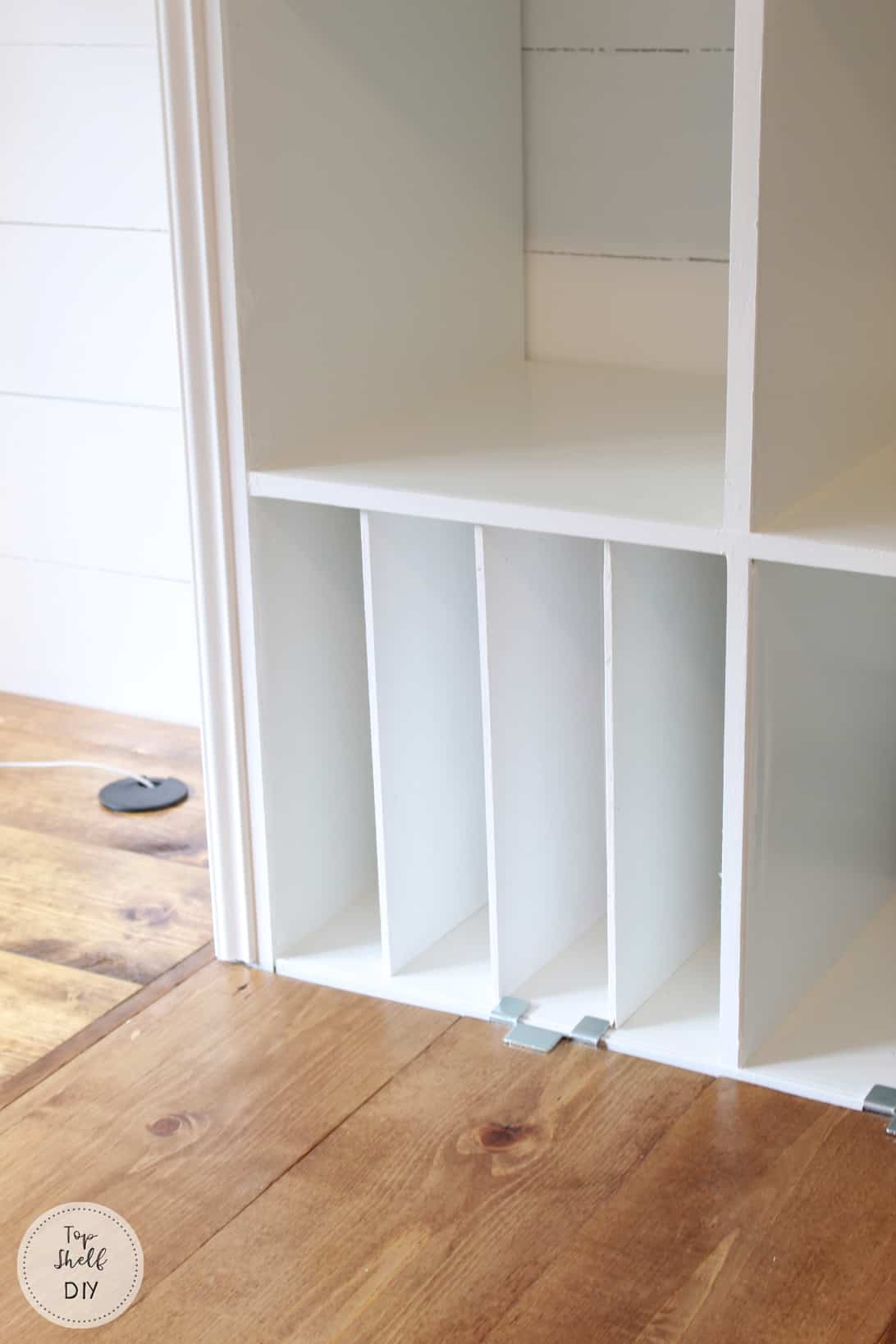 Add built-in organization with dividers made from plywood! Secured by small strips of wood inside. #ikeahack #kallax