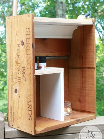 Make this shelf for essential oil storage from an old wine crate! Cheap, practical, and fun.