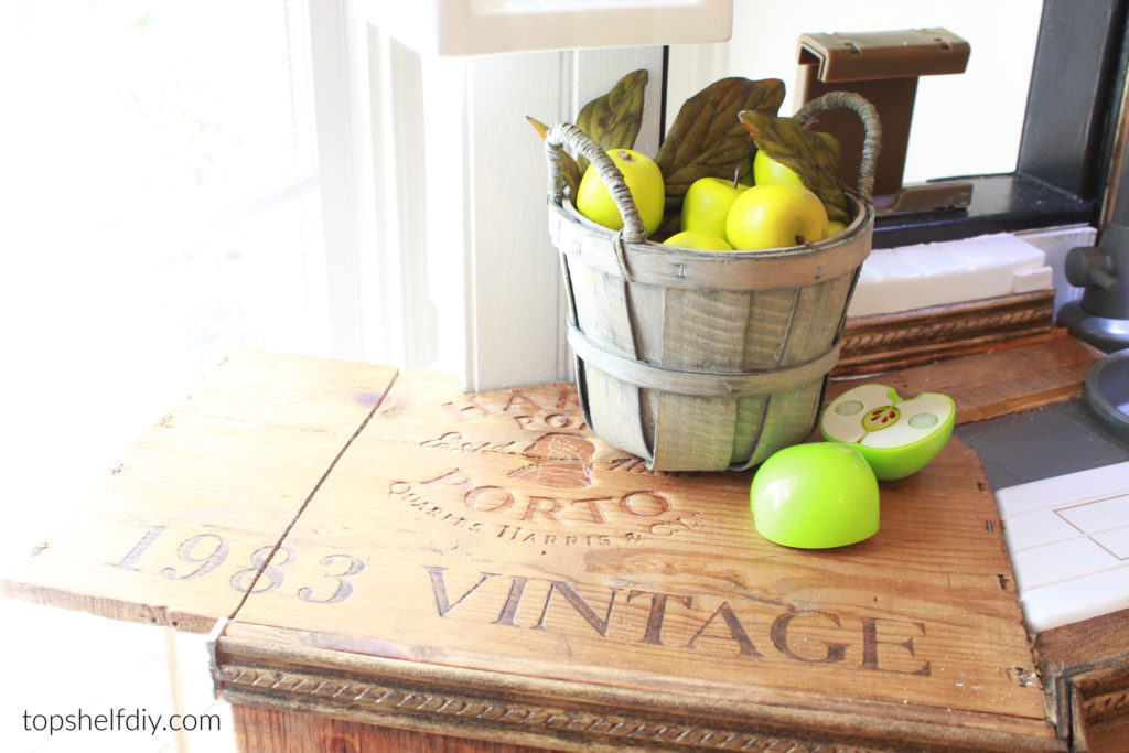 Apple table spread for kids kitchen hack. Fisher Price Kids Kitchen Hack: adding a drop leaf table from a repurposed wine crate. 