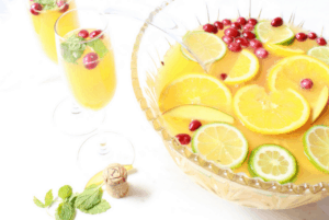 Make this simple recipe ahead of time for your upcoming NYE party! #nye #momcocktails #easychampagnepunch