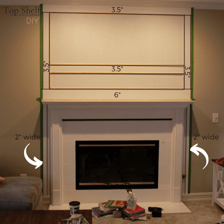Gorgeous fireplace with DIY magnolia garland. Here's how to update the space above the mantel with trim and white paint. #fireplacedecor #manteldecor #Marblefireplace
#Fireplacemakeover #Fireplacedesign #Modernfireplace #Seasonalmanteldécor
