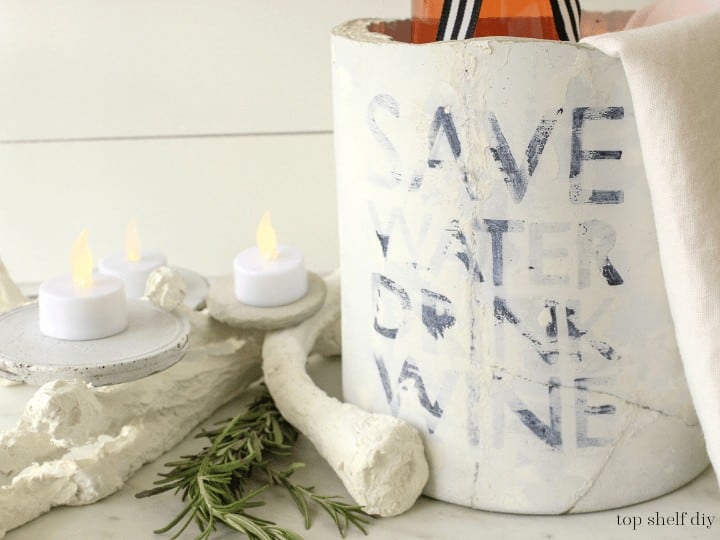 How to make an industrial concrete wine chiller bucket. Make one for your next holiday party or as a handmade holiday gift. Keeps your wine cold and your heart warm. #concretecrafts #concretedecor #holidayconcete 