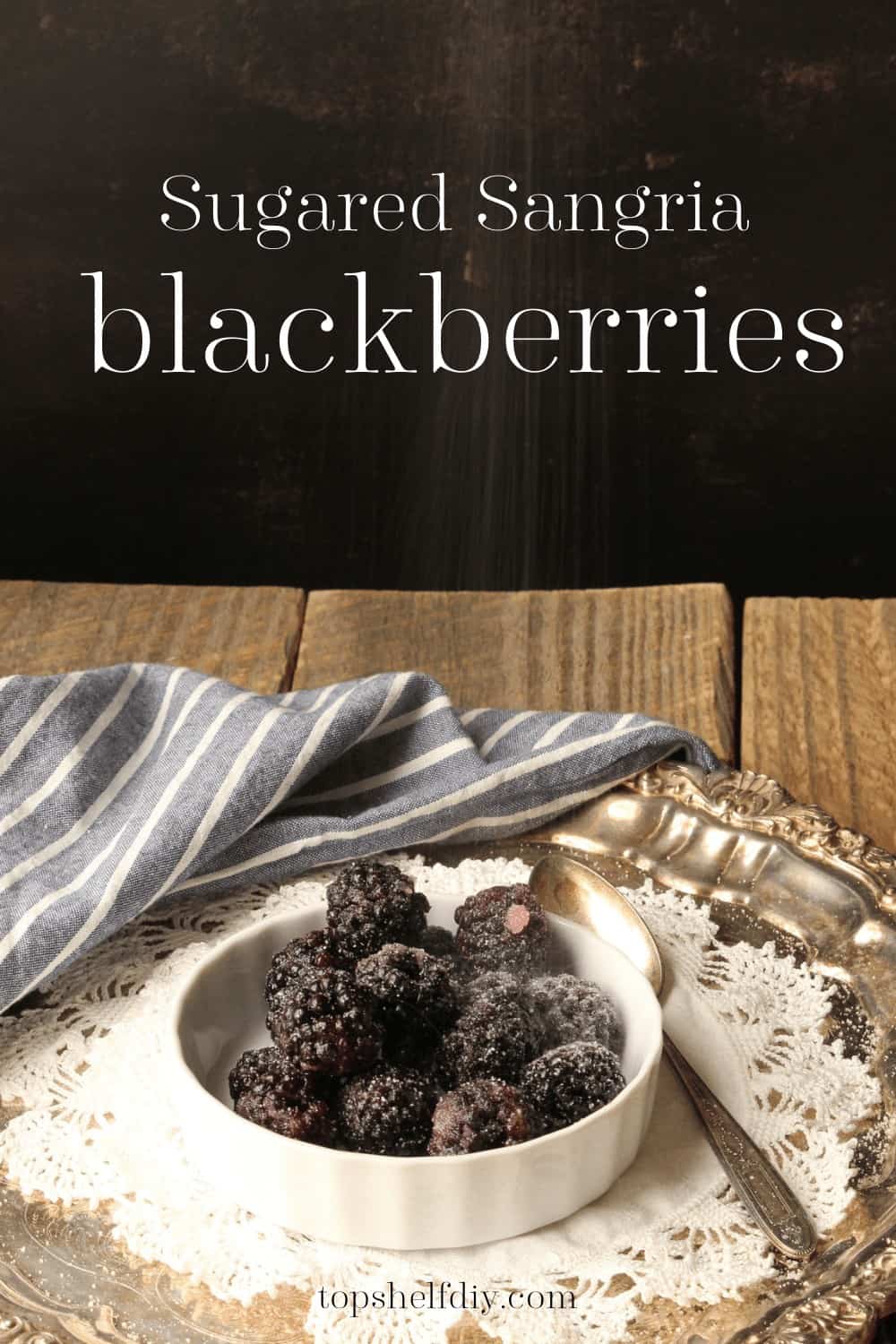 A sangria soak and light dusting of sugar make these frozen blackberries come to life as a decadent cocktail garnish. Get the easy recipe here! #boozyfruit #wineberries #momcocktails #sangriarecipe