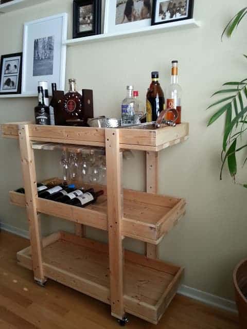 An Ikea Bar cart made from leftover IKEA bed slats. Total cost: $30. Tutorial courtesy of Nifty Nest. One of 18 bar cart hacks. 