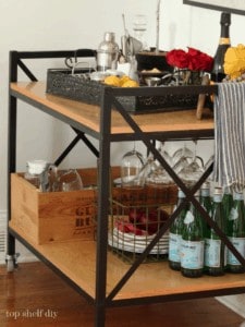 Learn how to DIY a fabulous metal bar cart styled with custom finishes and antiques! Free plans included.