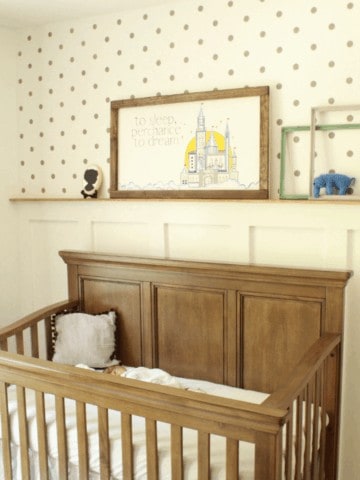 How we updated our second baby's room on a budget. Feature wall with board and batten, custom wood sign, stencil wall, and hemmed curtains.