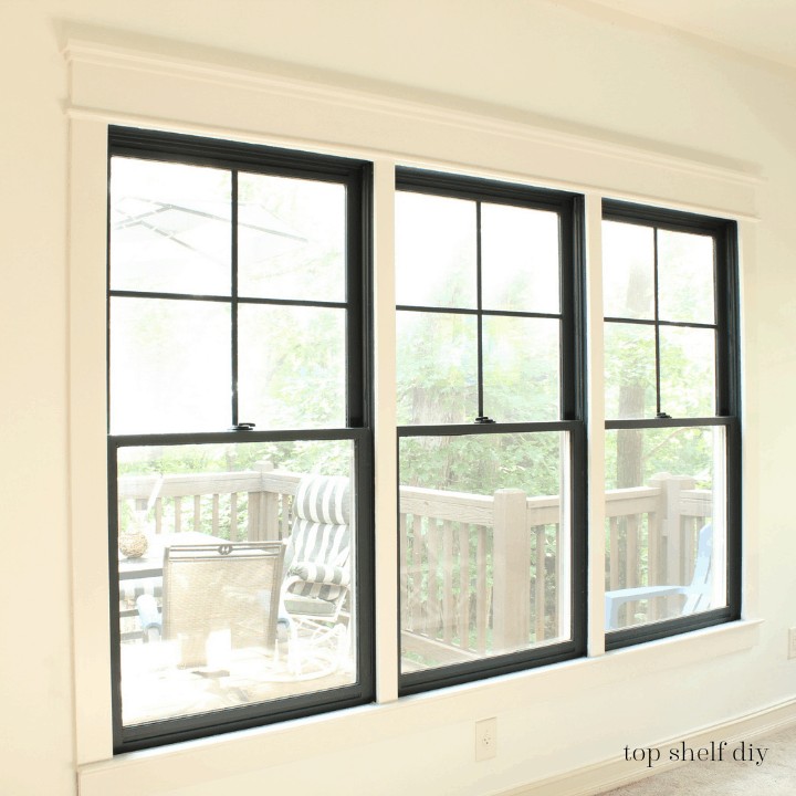 DIY Black Inset Windows trim painted in Cameo White by Benjamin Moore. Get the skinny on how I demo'd these windows, installed new trim, and added DIY Mullions! 