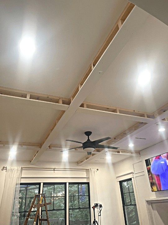 Coffered ceilings aren't as difficult to install as you'd think. Here's how to map them, build them, and finish them with custom trim. Total cost breakdown and timeline. #cofferedceiling #diycofferedceiling #livingroomrenovation