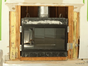 After demolishing our old fireplace mantel and tile surround!