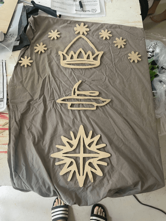 How I added 3D interest to my Mines of Moria doorway design. I cut out these pieces from scrap plywood on my scroll saw and then added magnets to the back. 